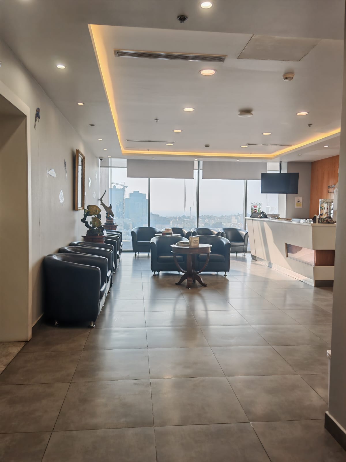 Actual clinic reception with seating and large windows