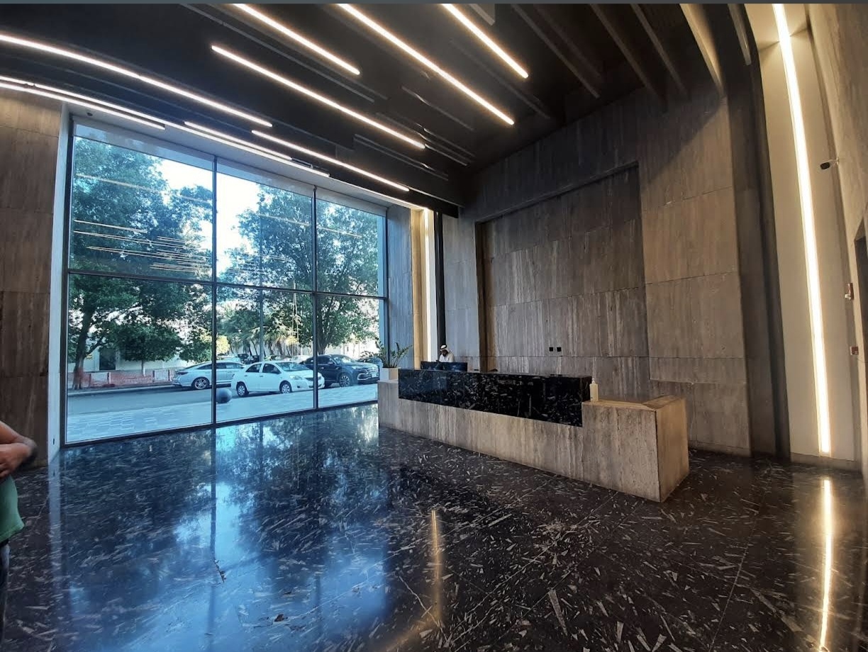 Actual main building lobby with seating and large windows